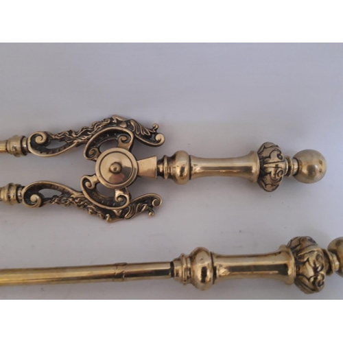 193 - A SET OF THREE VICTORIAN POLISHED BRASS FIRE IRONS, includes a shovel, poker & tongs, registered dat... 