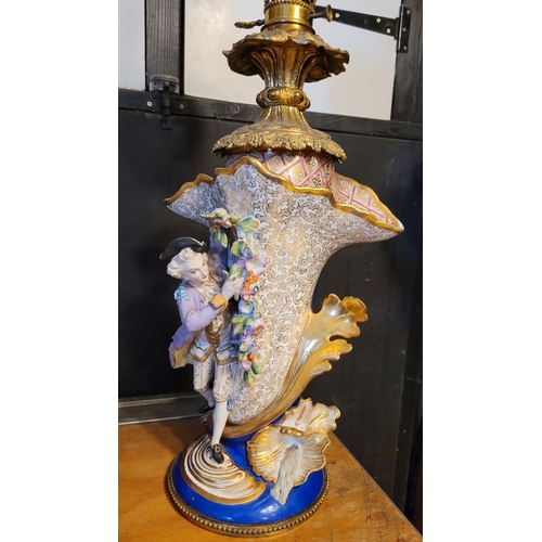 208 - AN IMPRESSIVE PAIR OF FRENCH PORCELAIN & BRASS OIL LAMPS, each with a detailed porcelain base, one w... 