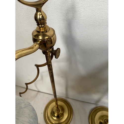 21 - A PAIR OF VINTAGE ADJUSTABLE BRASS TABLE LAMPS each with a glass shade with scalloped rim, the head ... 