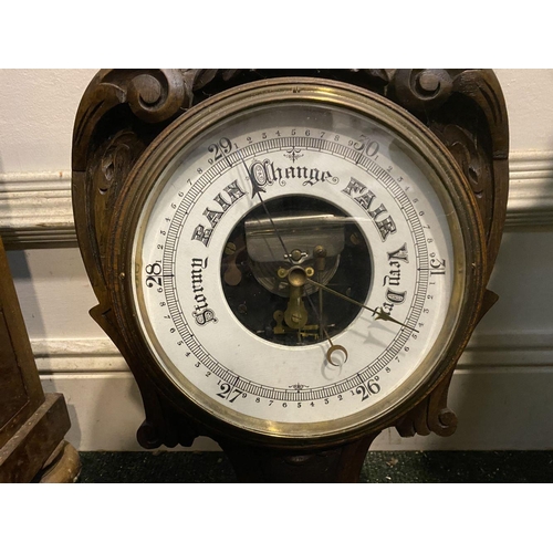 211 - AN ANTIQUE CARVED MAHOGANY BAROMETER, dial reading ‘Stormy, Rain, Chang, Fair, Very Dry’ within heav... 