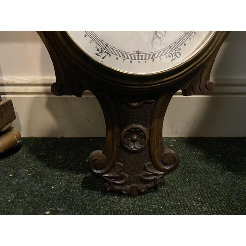 211 - AN ANTIQUE CARVED MAHOGANY BAROMETER, dial reading ‘Stormy, Rain, Chang, Fair, Very Dry’ within heav... 