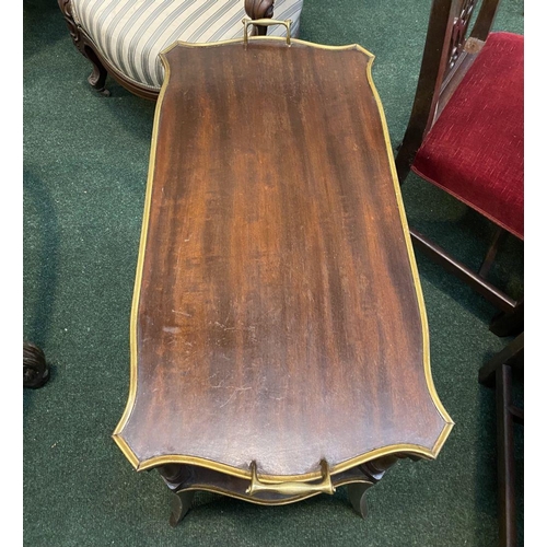 213 - AN ANTIQUE TWO TIER MAHOGANY SIDE TABLE, with gilt borders to shaped tiers, two handles, turned supp... 