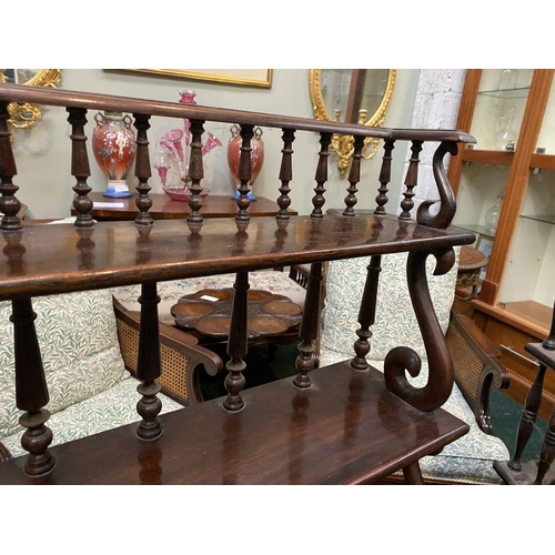 226 - AN ANTIQUE MAHOGANY WATERFALL FLOOR BOOKCASE, with five graduated shelves, turned supports to back, ... 