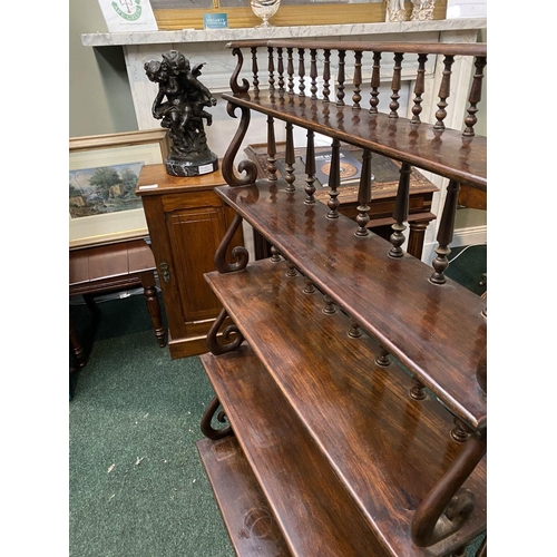 226 - AN ANTIQUE MAHOGANY WATERFALL FLOOR BOOKCASE, with five graduated shelves, turned supports to back, ... 