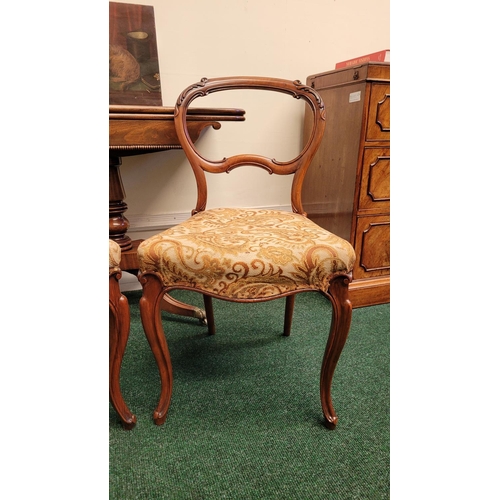 228 - A VERY GOOD PAIR OF VICTORIAN BALLOON BACK CHAIRS, each with carved acanthus leaf detail to the curv... 