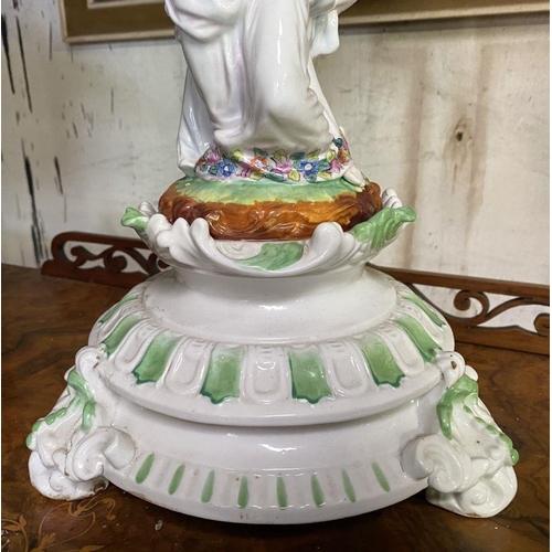 231 - A LARGE PORCELAIN COMPOTE CENTREPIECE, with flower encrusted basket, female figures to column standi... 