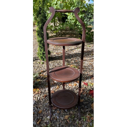 232 - A MAHOGANY INLAID THREE TIER CAKE STAND, inlay to three tiers, foldable, with handle. Dimensions: 88... 