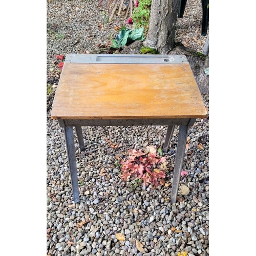 234 - A MID-CENTURY JAMES LEONARD FOR ESAVIAN CHILDS DESK, circa 1950, with metal body and wooden hinged t... 