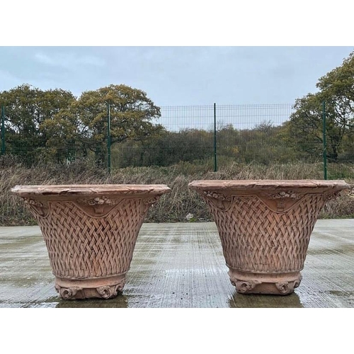 238 - A PAIR OF TERRACOTTA GARDEN PLANTERS, each with a lattice decoration all over and floral bouquets be... 