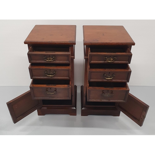 24 - A FINE PAIR OF 19TH CENTURY STRAIGHT GRAIN WALNUT BEDSIDE CABINETS / LAMP CABINETS, each with a set ... 