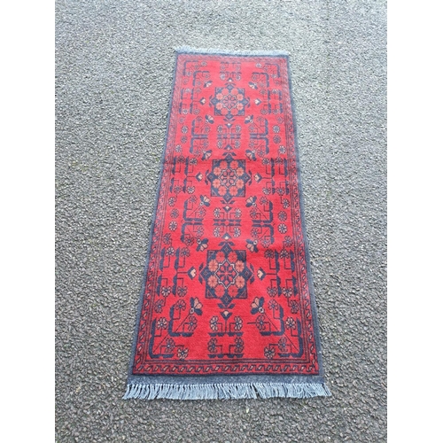 34 - A VERY GOOD QUALITY AFGHAN KHAN FLOOR RUG / RUNNER, with three floral medallions to the centre, surr... 