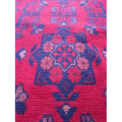 34 - A VERY GOOD QUALITY AFGHAN KHAN FLOOR RUG / RUNNER, with three floral medallions to the centre, surr... 