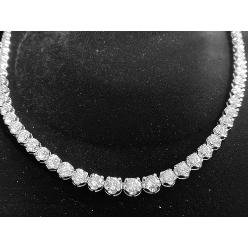 36 - A WONDERFUL 18CT WHITE GRADUATED DIAMOND NECKLACE, claw set with 15.62cts of graduated brilliant cut... 