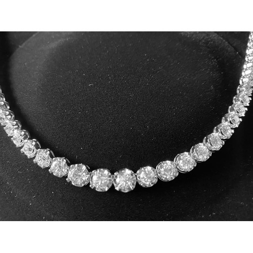 36 - A WONDERFUL 18CT WHITE GRADUATED DIAMOND NECKLACE, claw set with 15.62cts of graduated brilliant cut... 