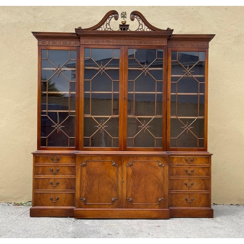 38 - A VERY FINE GOOD QUALITY MAHOGANY BREAK FRONT GLAZED LIBRARY BOOKCASE, to the top is a swan neck ped... 