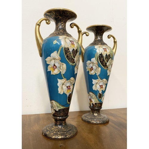 41 - A PAIR OF FINE ANTIQUE PHOENIX WARE VASES, with scroll handles, fluted rim, tapered body on circular... 