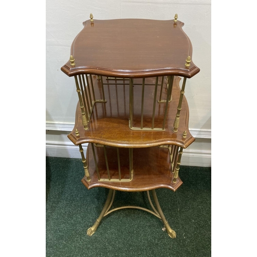 44 - AN ANTIQUE MAHOGANY AND BRASS REVOLVING BOOKCASE, with two shaped tiers supported by cast brass supp... 