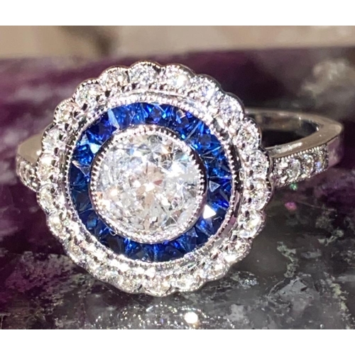 5 - AN ART DECO 18CT WHITE GOLD SAPPHIRE & DIAMOND TARGET RING, diamonds surrounding the French cut sapp... 