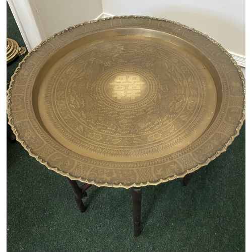 50 - AN ANTIQUE ANGLO/INDIAN FOLDING SIDE TABLE, brass embossed shaped circular top, with character mark ... 