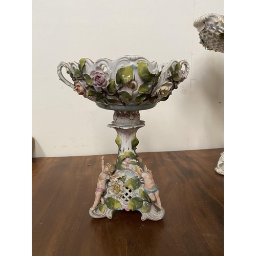 51 - A DRESDEN STYLE PORCELAIN COMPOTE, highly decorative with reticulated 'basket' bowl on stand all wit... 