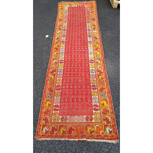 52 - AN ANTQIUE CAUCASIAN FLOOR RUNNER; with beautiful bright & cheerful colour palette, decorated all ov... 