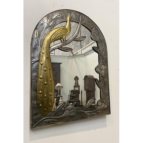 53 - A LOVELY ART NOUVEAU ARCHED WALL MIRROR, with decorative brass frame depicting peacock on branch wit... 