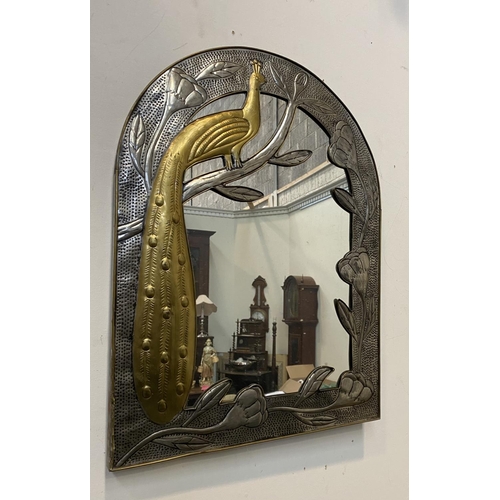 53 - A LOVELY ART NOUVEAU ARCHED WALL MIRROR, with decorative brass frame depicting peacock on branch wit... 