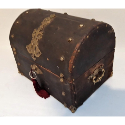 59 - AN ANTIQUE DOMED BRASS MOUNTED CASKET BOX, with original key present, box perhaps used in the past t... 