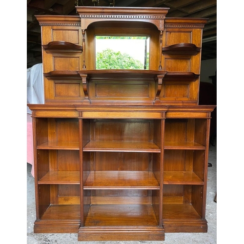 64 - A GOOD QUALITY MAHOGANY OPEN BREAK-FRONT FLOOR BOOKCASE, with a raised back gallery to the top, with... 