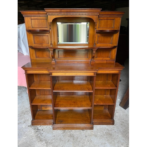 64 - A GOOD QUALITY MAHOGANY OPEN BREAK-FRONT FLOOR BOOKCASE, with a raised back gallery to the top, with... 