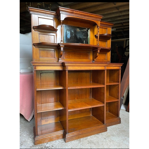 64 - A GOOD QUALITY MAHOGANY OPEN BREAK-FRONT FLOOR BOOKCASE, with a raised back gallery to the top, with... 