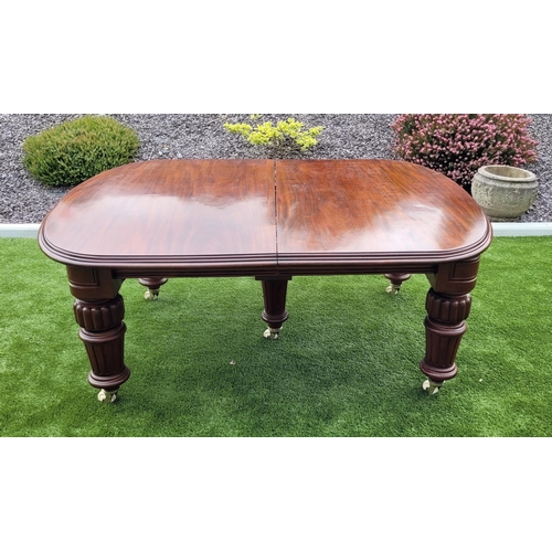 68 - A MAGNIFICENT MID 19TH CENTURY EXTENDING D-END MAHOGANY DINING TABLE, with moulded edging, standing ... 