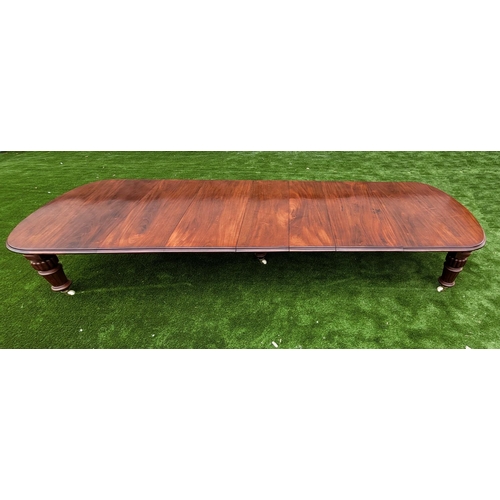 68 - A MAGNIFICENT MID 19TH CENTURY EXTENDING D-END MAHOGANY DINING TABLE, with moulded edging, standing ... 