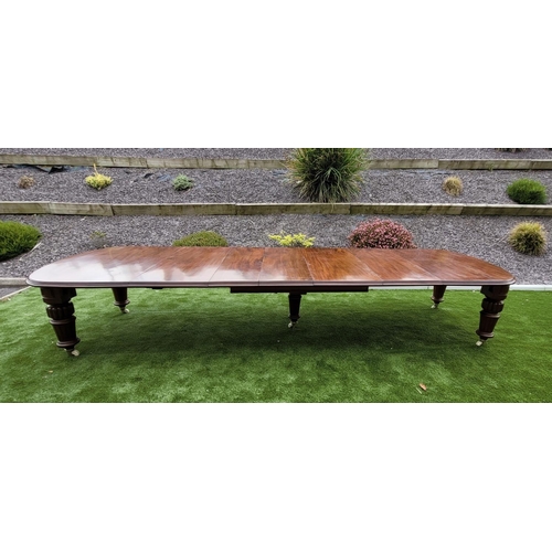 68 - A MAGNIFICENT MID 19TH CENTURY EXTENDING D-END MAHOGANY DINING TABLE, with moulded edging, standing ... 