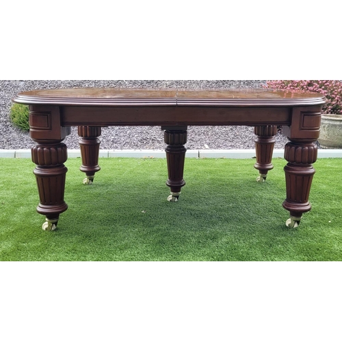 68 - A MAGNIFICENT MID 19TH CENTURY EXTENDING D-END MAHOGANY DINING TABLE, with moulded edging, standing ... 