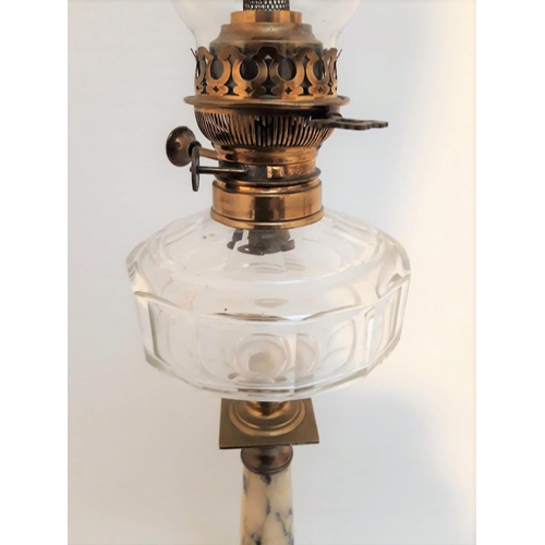 76 - A LARGE VICTORIAN OIL LAMP, with clear glass chimney & reservoir, the column base with stone body, t... 