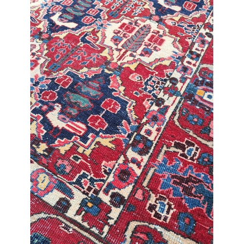 79 - A VERY GOOD QUALITY & BEAUTIFUL ANTIQUE PERSIAN BAKHTIARI FLOOR RUG, the field design is of a series... 