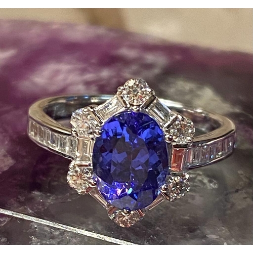 83 - A SUPERB 18CT WHITE GOLD TANZANITE & DIAMOND CLUSTER RING, tanzanite weight: 2.00cts surrounded by s... 