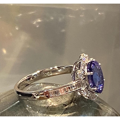 83 - A SUPERB 18CT WHITE GOLD TANZANITE & DIAMOND CLUSTER RING, tanzanite weight: 2.00cts surrounded by s... 