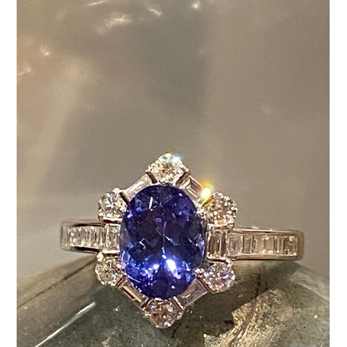 83 - A SUPERB 18CT WHITE GOLD TANZANITE & DIAMOND CLUSTER RING, tanzanite weight: 2.00cts surrounded by s... 