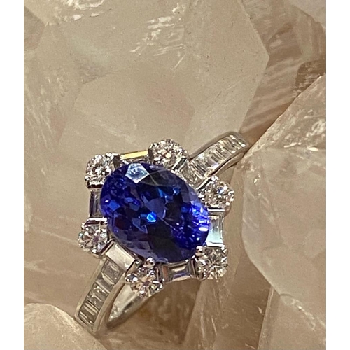 83 - A SUPERB 18CT WHITE GOLD TANZANITE & DIAMOND CLUSTER RING, tanzanite weight: 2.00cts surrounded by s... 