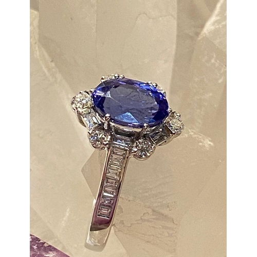 83 - A SUPERB 18CT WHITE GOLD TANZANITE & DIAMOND CLUSTER RING, tanzanite weight: 2.00cts surrounded by s... 