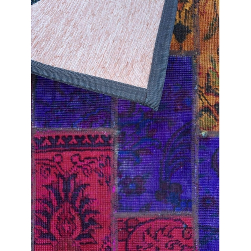 87 - A VIBRANT PERSIAN PATCHWORK RUG, featuring dyed patches of traditional Persian rugs in various desig... 