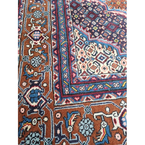 9 - A LARGE & GOOD QUALITY BRIGHTLY COLOURED HAND-KNOTTED PERSIAN TABRIZ FLOOR RUG, to the centre is a l... 