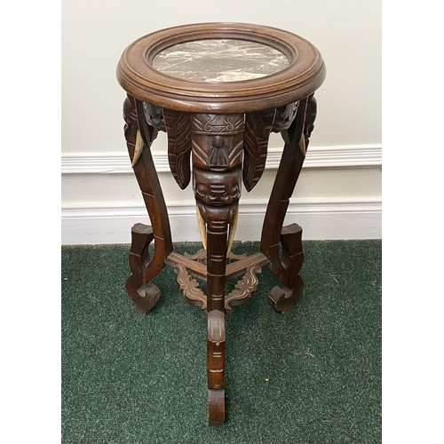 94 - A FRENCH CARVED MAHOGANY MARBLE TOPPED SIDE TABLE/PLANT STAND, intricately carved with elephant desi... 