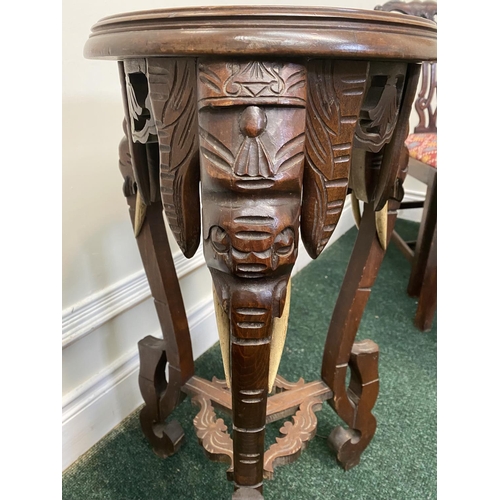 94 - A FRENCH CARVED MAHOGANY MARBLE TOPPED SIDE TABLE/PLANT STAND, intricately carved with elephant desi... 