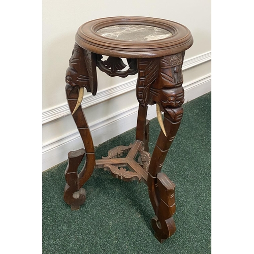 94 - A FRENCH CARVED MAHOGANY MARBLE TOPPED SIDE TABLE/PLANT STAND, intricately carved with elephant desi... 