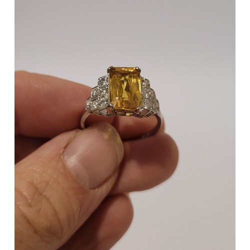 11 - A VERY BEAUTIFUL ART DECO INSPIRED YELLOW SAPPHIRE & DIAMOND PLATINUM RING, the central set emerald ... 