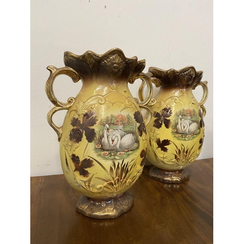 110 - A PAIR OF LOVELY VINTAGE PAINTED PORCELAIN VASES, ornate shape with double scroll handles, decorated... 