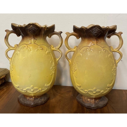 110 - A PAIR OF LOVELY VINTAGE PAINTED PORCELAIN VASES, ornate shape with double scroll handles, decorated... 